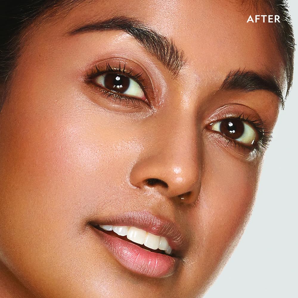 Close-up of silk-texture concealer applying without creasing under the eye.