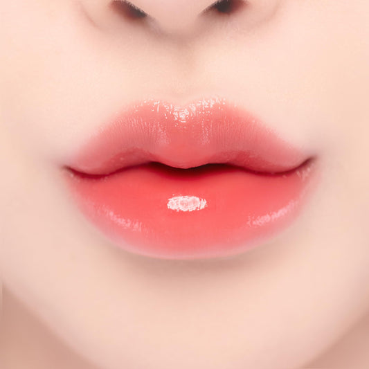 YNM Candy Gloss Balm Coral Moment color swatch for vivid lips