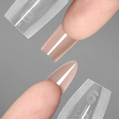 YOKE FELLOW almond-shape nail form creates balanced, elegant extensions.