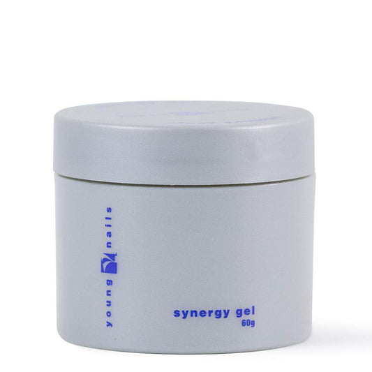 Young Nails Synergy base gel applying foundation layer for durable adhesion.