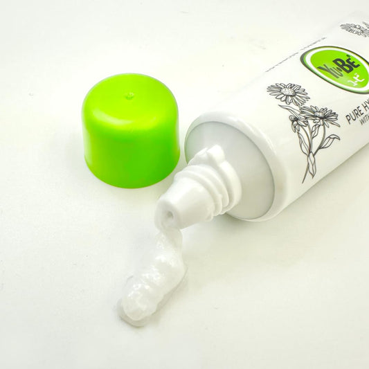 Yu-Be Pure Hydration Cream being applied to the hand for quick absorption