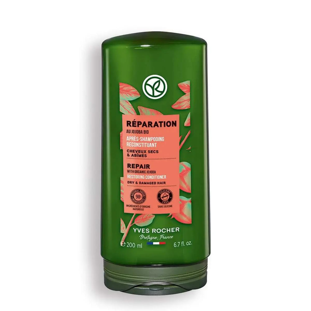 Yves Rocher nourishing conditioner bottle close-up shows jojoba oil for dry hair care.