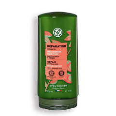 Yves Rocher nourishing conditioner bottle close-up shows jojoba oil for dry hair care.
