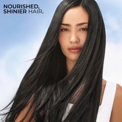 Yves Rocher Raspberry Shine Hair Vinegar liquid glistens, suggesting buildup-free, light hair