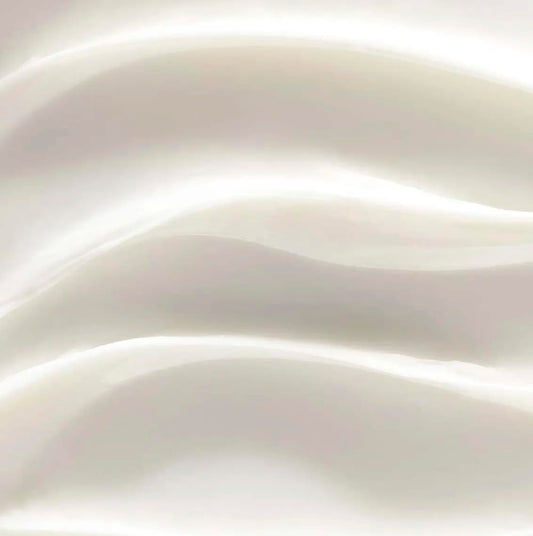 Rich texture swirl of Yves Rocher Riche Creme highlighting nourishing, smoothing cream.