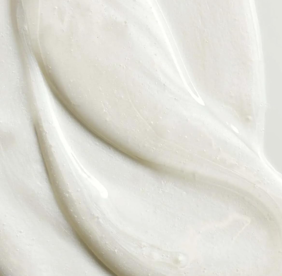Yves Rocher shampoo jojoba oil texture close-up showing lightweight hydration for hair.