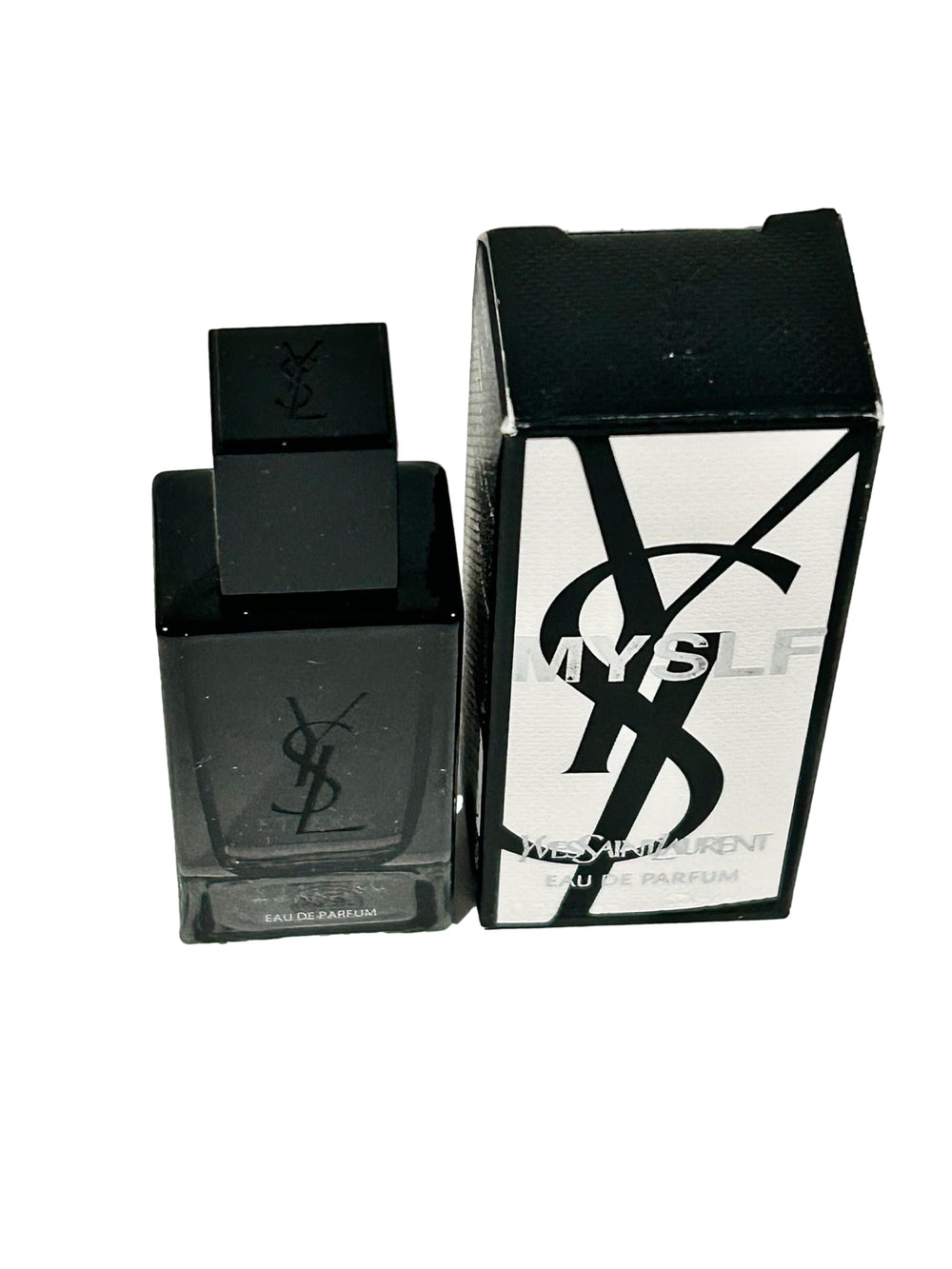 Yves Saint Laurent MYSLF miniature bottle close-up, showcasing elegant design and portable luxury.