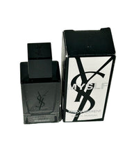 Yves Saint Laurent MYSLF miniature bottle close-up, showcasing elegant design and portable luxury.