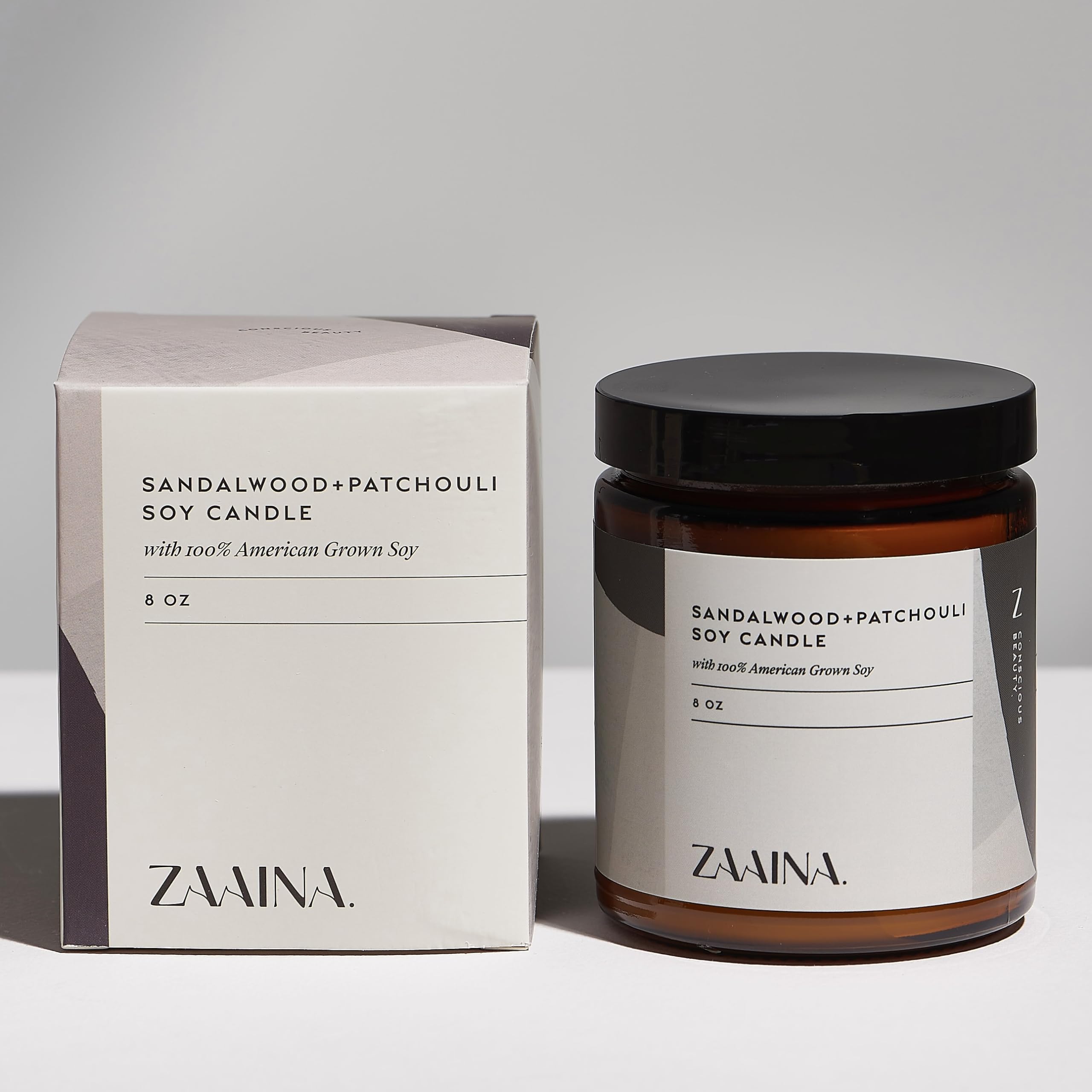 ZAAINA sandalwood candle in the gift box creating a relaxing ambience.