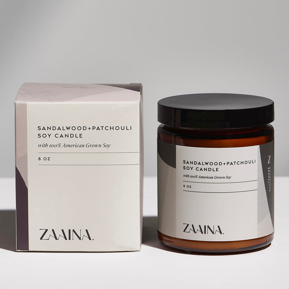 ZAAINA sandalwood candle in the gift box creating a relaxing ambience.