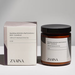 ZAAINA sandalwood candle in the gift box creating a relaxing ambience.