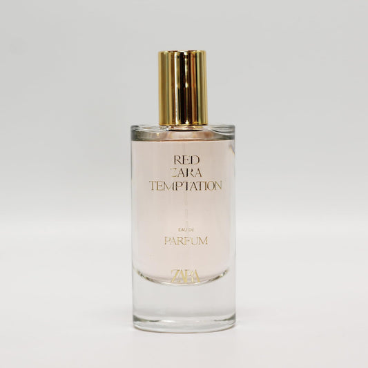 Zara Red Temptation bottle being poured highlights a vibrant, long-lasting aroma for evening events.