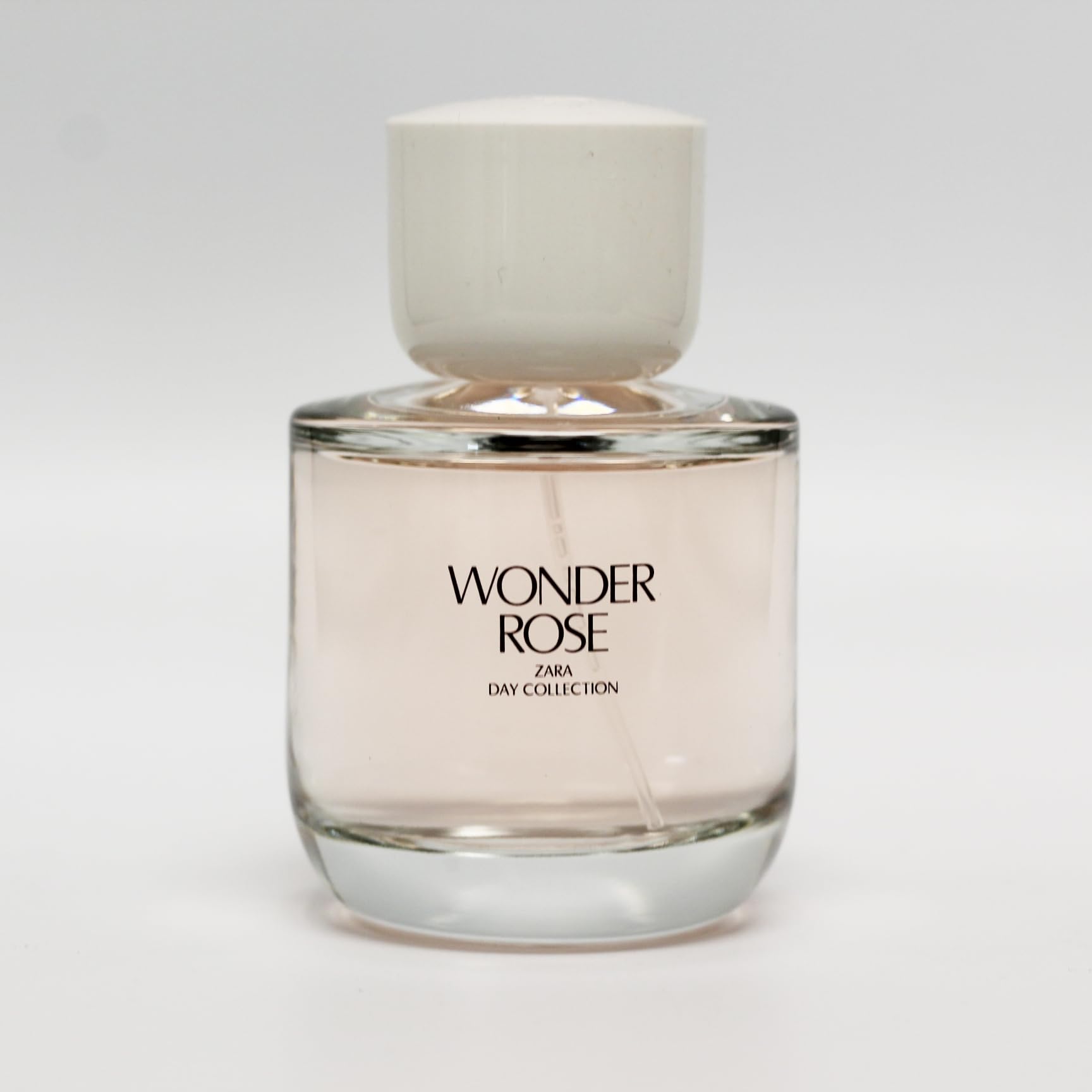 Zara Wonder Rose top notes peach and red berries, offering a fresh daytime scent.