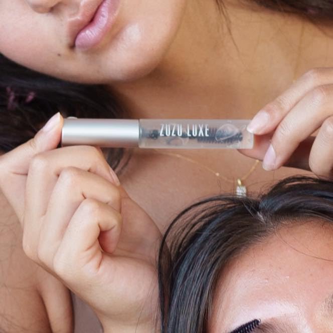 Zuzu Luxe Clear Mascara brush application showing smooth lash definition