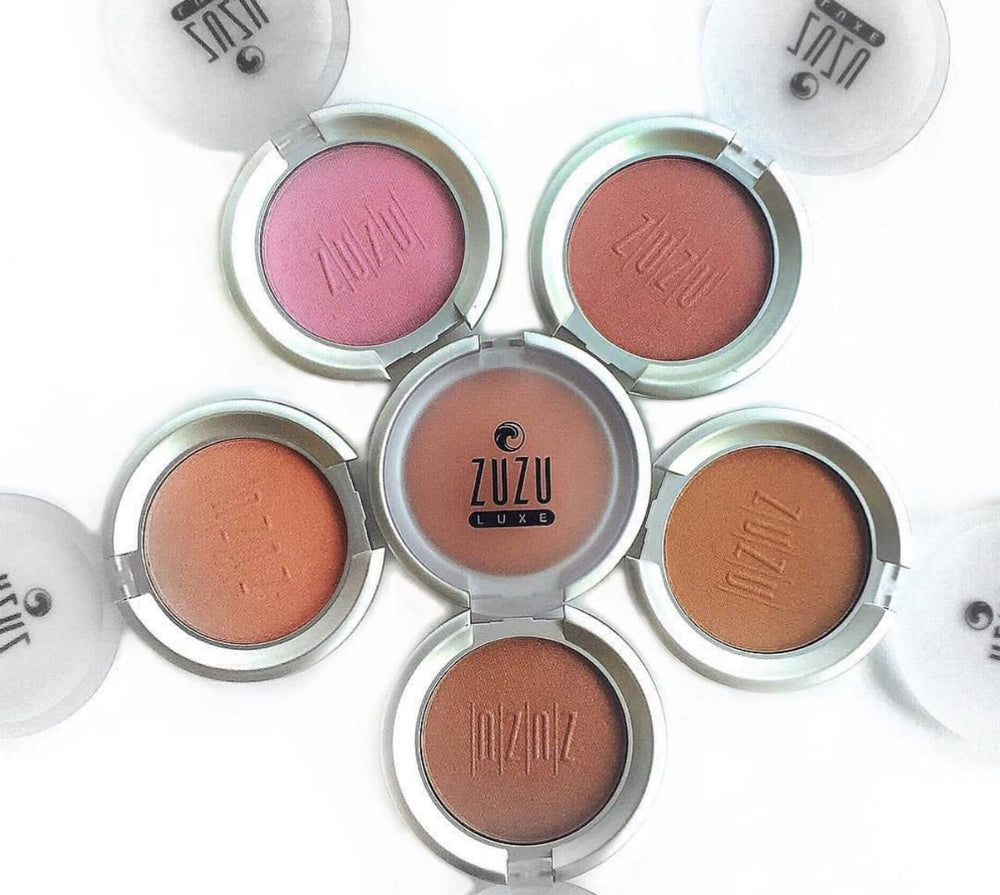 Zuzu Luxe Samba compact lid with visible warm shimmer.
